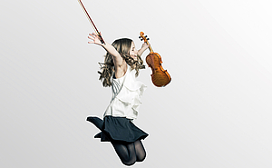 The picture shows a jumping girl with a violin in her hand. 