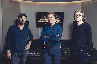 The picture shows three man.