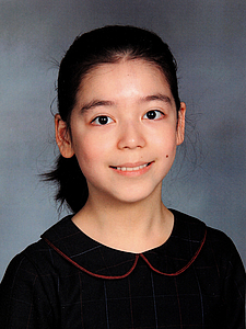 The picture shows a young person with a violin.