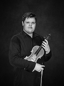 The picture shows a young person with a violin.