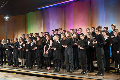 The picture shows a choir on a stage.
