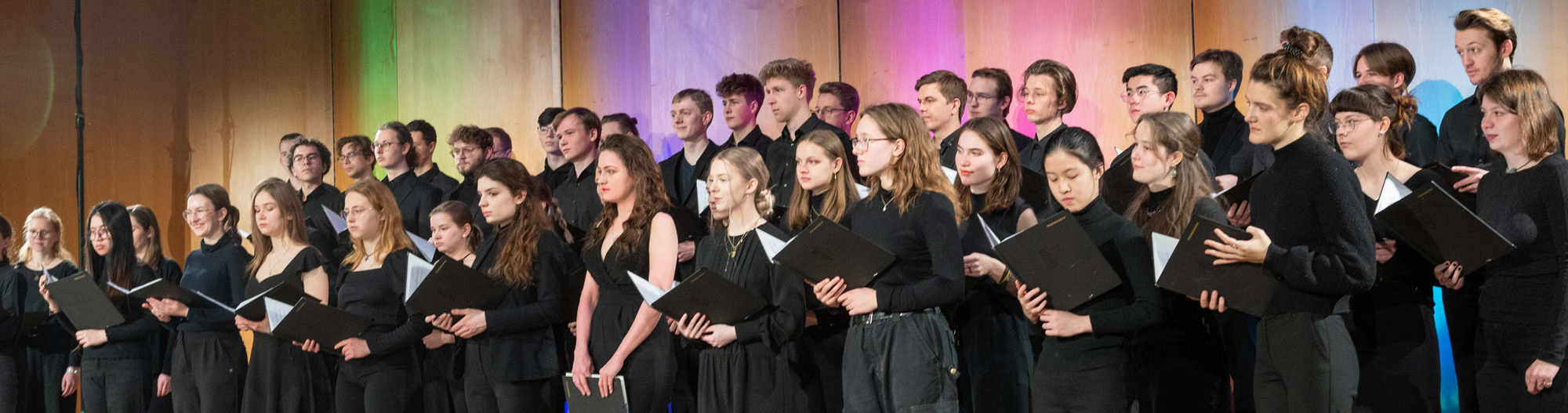 The image shows people on a stage.