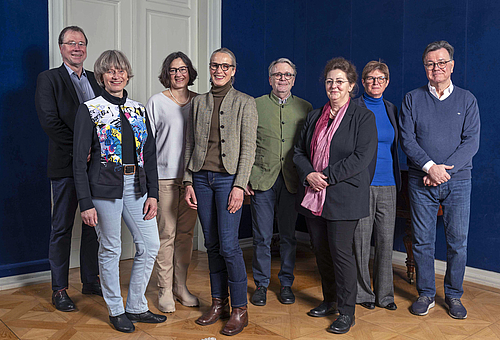 The picture shows a group of people.