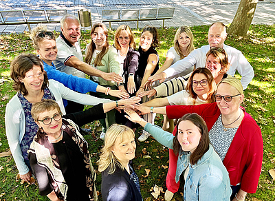 The picture shows a group of people.