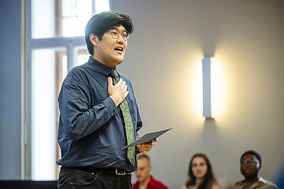 The picture shows a singing man.