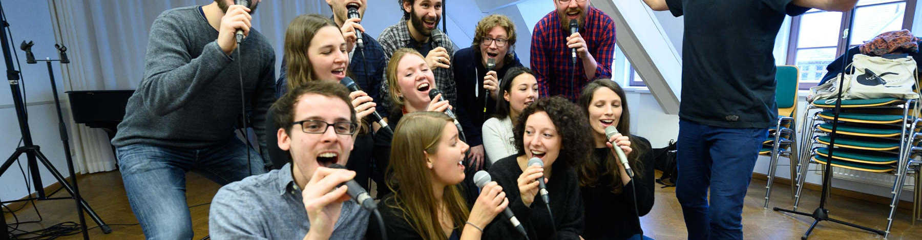 The image shows a group of singers.