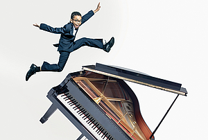 The picture shows a young man jumping over a grand piano.
